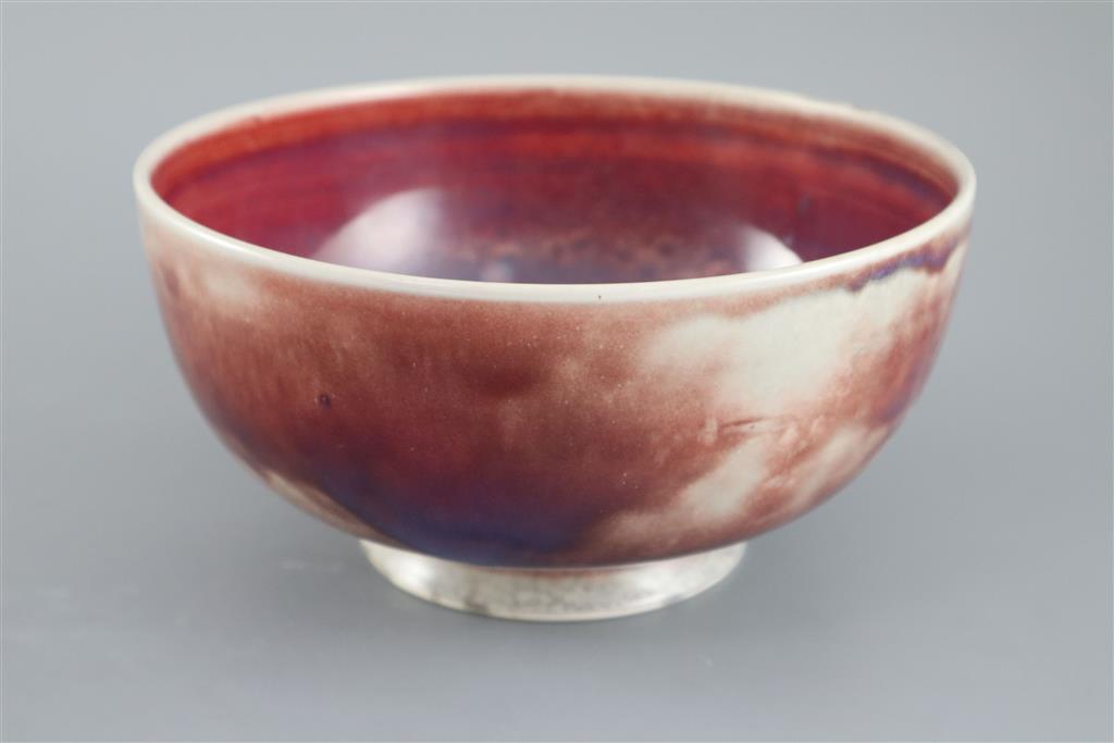 A Ruskin high fired flambe footed bowl, dated 1924, 22cm diameter